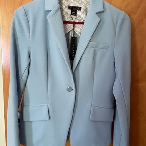 Light Blue Blazer new with Tags. XS runs a size bigger (S)